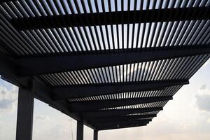 Canopy for protection from the hot sun in a city park. photo