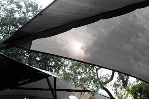 Canopy for protection from the hot sun in a city park. photo