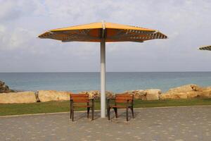 Canopy for protection from the hot sun in a city park. photo