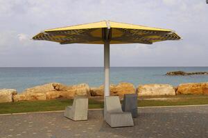 Canopy for protection from the hot sun in a city park. photo