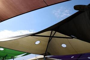 Canopy for protection from the hot sun in a city park. photo