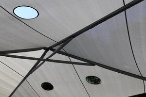 Canopy for protection from the hot sun in a city park. photo