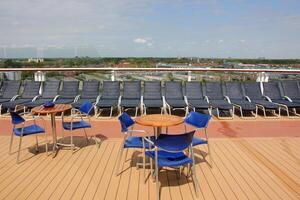 On the upper deck of a large ocean liner. photo