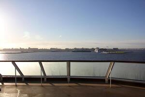 On the upper deck of a large ocean liner. photo