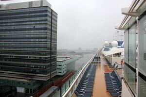 On the upper deck of a large ocean liner. photo