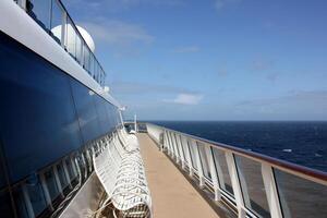 On the upper deck of a large ocean liner. photo