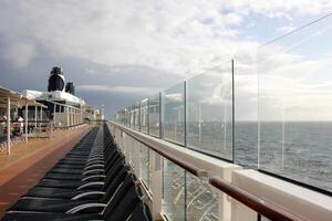 On the upper deck of a large ocean liner. photo