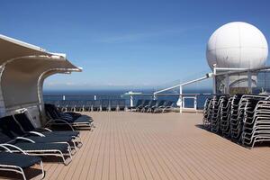 On the upper deck of a large ocean liner. photo