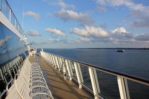 On the upper deck of a large ocean liner. photo