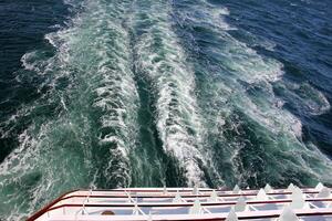 On the upper deck of a large ocean liner. photo