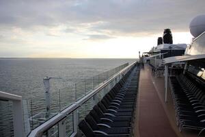 On the upper deck of a large ocean liner. photo