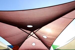 Canopy for protection from the hot sun in a city park. photo