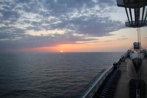 On the upper deck of a large ocean liner. photo