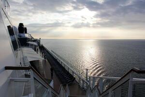 On the upper deck of a large ocean liner. photo