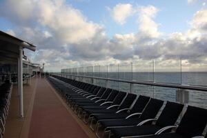 On the upper deck of a large ocean liner. photo