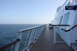 On the upper deck of a large ocean liner. photo