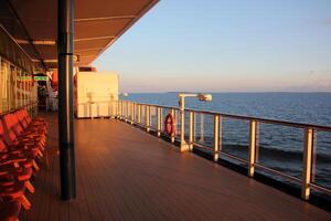 On the upper deck of a large ocean liner. photo