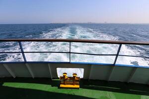 On the upper deck of a large ocean liner. photo