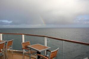 On the upper deck of a large ocean liner. photo