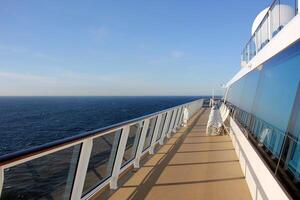 On the upper deck of a large ocean liner. photo