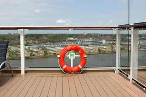 On the upper deck of a large ocean liner. photo