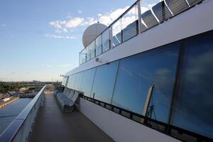 On the upper deck of a large ocean liner. photo