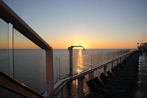 On the upper deck of a large ocean liner. photo