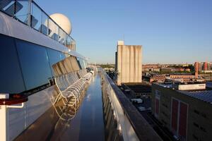 On the upper deck of a large ocean liner. photo