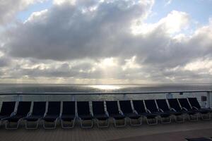 On the upper deck of a large ocean liner. photo