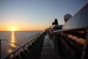 On the upper deck of a large ocean liner. photo