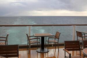 On the upper deck of a large ocean liner. photo