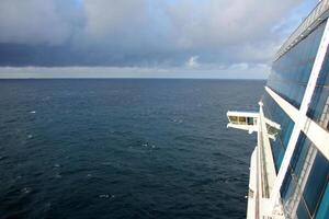 On the upper deck of a large ocean liner. photo