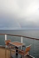 On the upper deck of a large ocean liner. photo