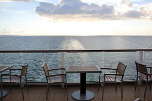 On the upper deck of a large ocean liner. photo