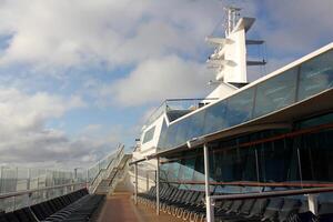 On the upper deck of a large ocean liner. photo