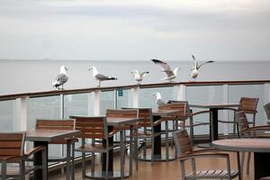 On the upper deck of a large ocean liner. photo