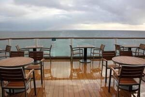 On the upper deck of a large ocean liner. photo