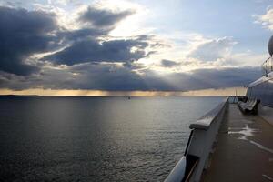 On the upper deck of a large ocean liner. photo