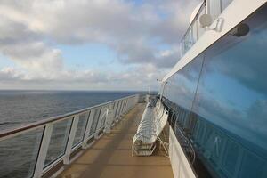 On the upper deck of a large ocean liner. photo