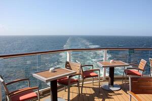 On the upper deck of a large ocean liner. photo