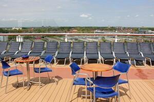 On the upper deck of a large ocean liner. photo