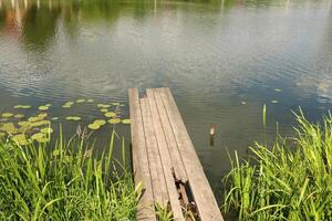 A pier on the shore for mooring boats and yachts. photo