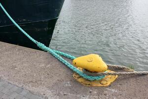 A pier on the shore for mooring boats and yachts. photo