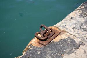 A pier on the shore for mooring boats and yachts. photo