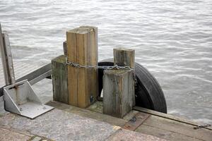 A pier on the shore for mooring boats and yachts. photo