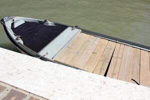 A pier on the shore for mooring boats and yachts. photo