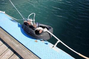 A pier on the shore for mooring boats and yachts. photo