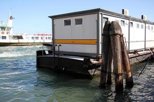 A pier on the shore for mooring boats and yachts. photo