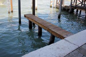 A pier on the shore for mooring boats and yachts. photo