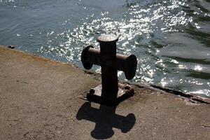 A pier on the shore for mooring boats and yachts. photo